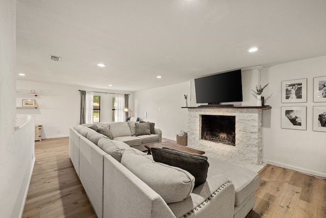 1764 Brown Trl, Hurst, TX 76054 - living room featuring a fireplace, recessed lighting, light wood-type flooring, and baseboards