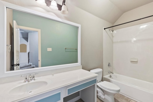 bathroom featuring vanity, tub / shower combination, toilet, lofted ceiling, and tile patterned flooring