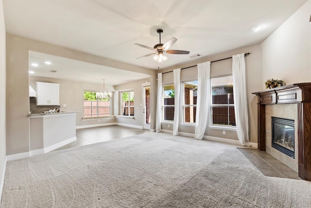 unfurnished living room featuring recessed lighting, visible vents, baseboards, a tiled fireplace, and ceiling fan