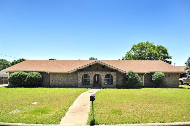 6709 Santiago Ave, Fort Worth, TX 76133 - ranch-style house with a front lawn, brick siding, and roof with shingles
