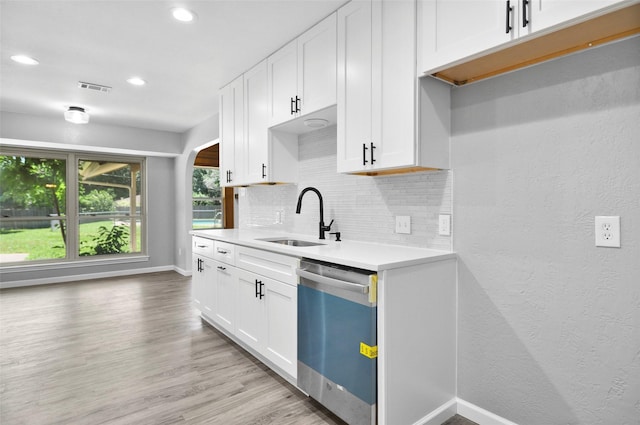 6709 Santiago Ave, Fort Worth, TX 76133 - kitchen featuring dishwasher, a sink, backsplash, light countertops, and baseboards