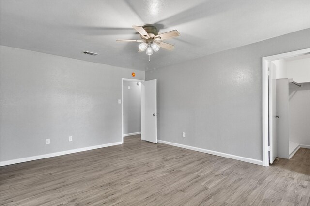 6709 Santiago Ave, Fort Worth, TX 76133 - unfurnished bedroom featuring wood finished floors, baseboards, a closet, and a spacious closet