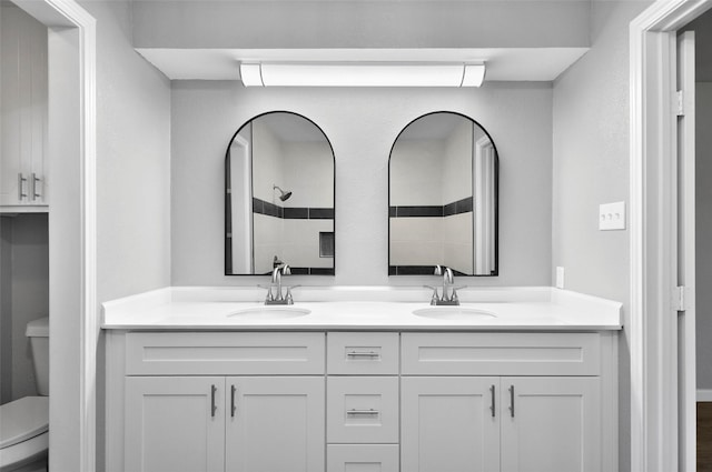 6709 Santiago Ave, Fort Worth, TX 76133 - bathroom featuring toilet, double vanity, and a tile shower