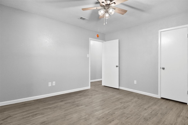 6709 Santiago Ave, Fort Worth, TX 76133 - unfurnished bedroom with wood finished floors, baseboards, and ceiling fan