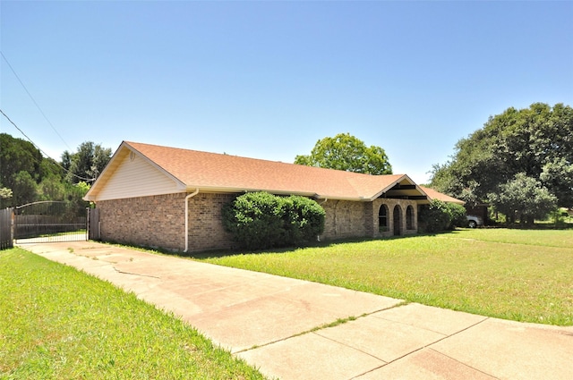 6709 Santiago Ave, Fort Worth, TX 76133 - view of property exterior with brick siding and concrete driveway