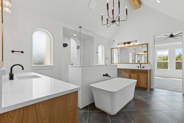 7103 Heathington Ct, Granbury, TX 76049 - bathroom with a sink, two vanities, a freestanding tub, beamed ceiling, and walk in shower