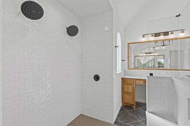 7103 Heathington Ct, Granbury, TX 76049 - bathroom with tile patterned flooring, tiled shower, and vanity