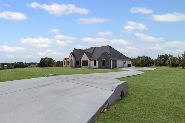 7103 Heathington Ct, Granbury, TX 76049 - view of front of home featuring concrete driveway, board and batten siding, a front lawn, and a garage