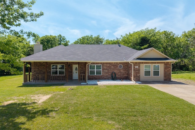 single story home with a porch, a front lawn, a chimney, and brick siding
