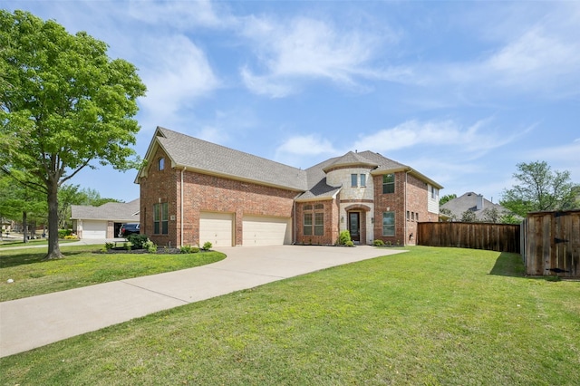 french provincial home featuring brick siding, a front yard, and fence