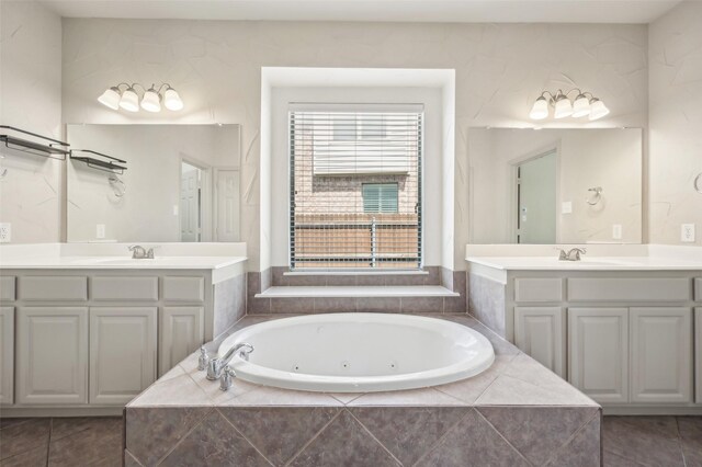 9616 Barksdale Dr, Fort Worth, TX 76244 - bathroom with two vanities, a jetted tub, and tile patterned flooring
