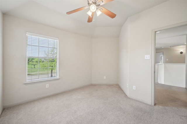 unfurnished room with ceiling fan, light carpet, and baseboards
