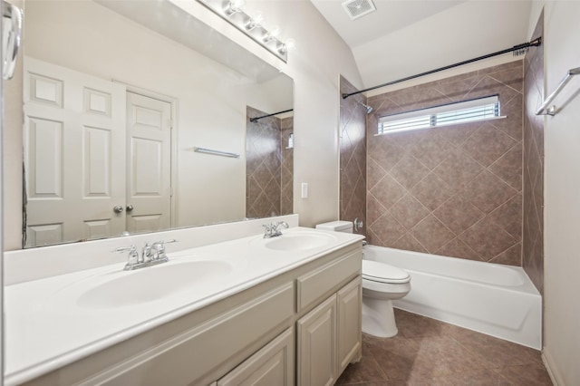 full bath with toilet, washtub / shower combination, a sink, and visible vents