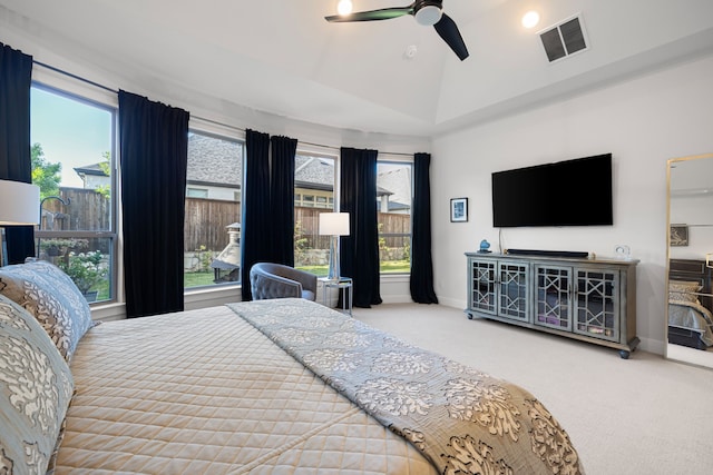 bedroom featuring ceiling fan, carpet, baseboards, lofted ceiling, and visible vents