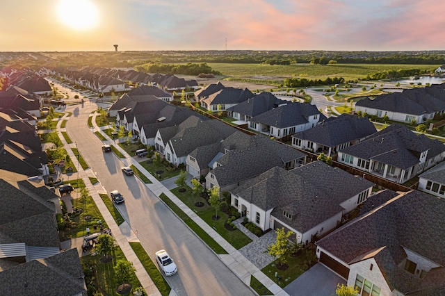 aerial view at dusk with a residential view