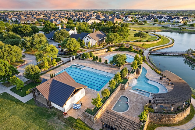 aerial view featuring a residential view and a water view