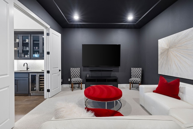 living room with recessed lighting, wood finished floors, indoor wet bar, and wine cooler