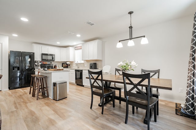 1208 Perrin Dr, Forney, TX 75126 - dining room featuring light wood-style floors, recessed lighting, and baseboards