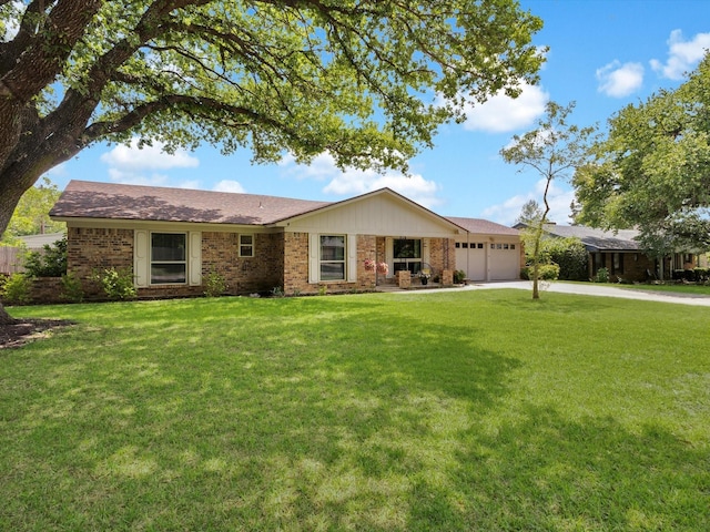 ranch-style home featuring a front lawn, driveway, an attached garage, and brick siding