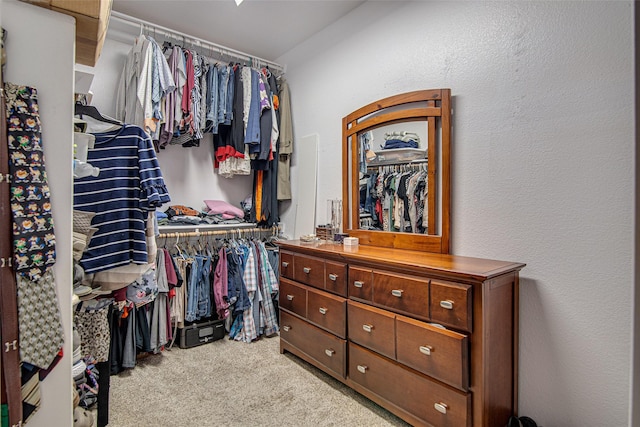 spacious closet with carpet floors