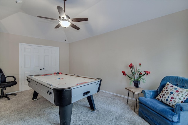 playroom with vaulted ceiling, ceiling fan, baseboards, and light carpet