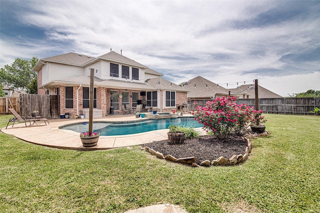 view of pool featuring a fenced backyard, a yard, and a patio