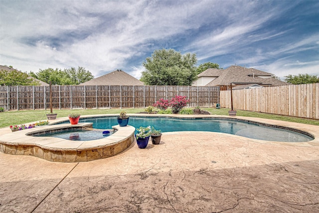 view of swimming pool featuring a fenced in pool, a patio, a fenced backyard, and an in ground hot tub