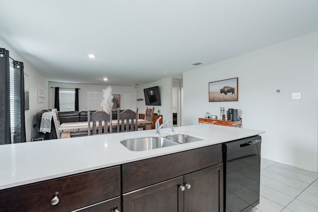 kitchen featuring light countertops, a sink, dark brown cabinetry, black dishwasher, and open floor plan