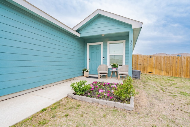 property entrance with fence