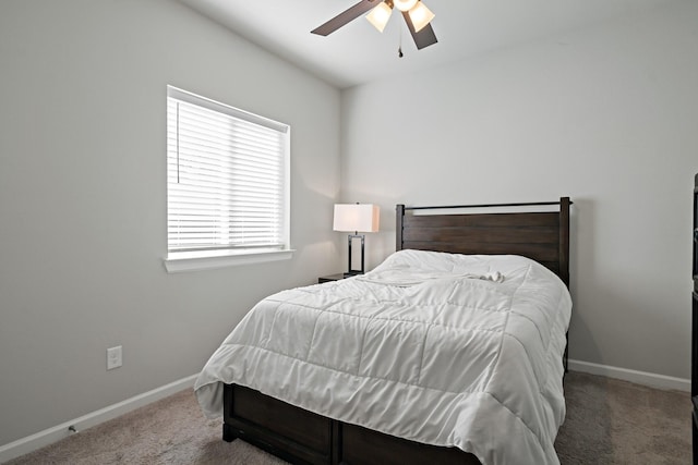 bedroom with baseboards, a ceiling fan, and carpet flooring