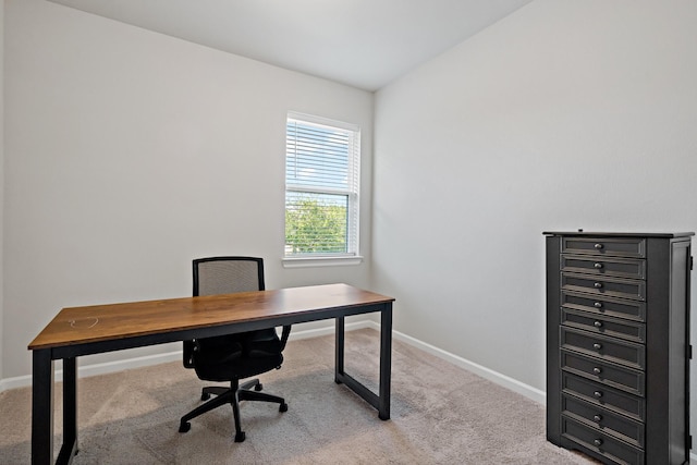 carpeted home office with baseboards