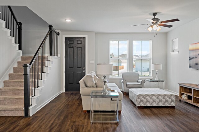 living room with stairway, a ceiling fan, baseboards, dark wood-style flooring, and recessed lighting