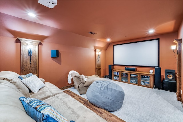 carpeted home theater featuring recessed lighting, visible vents, and ornate columns