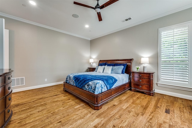 bedroom featuring light wood-type flooring, visible vents, and baseboards