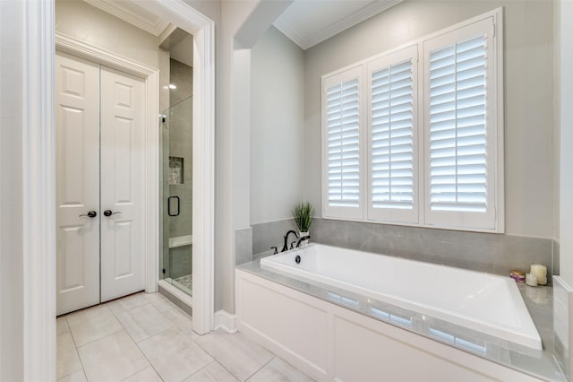 bathroom with a shower stall, a bath, tile patterned flooring, and ornamental molding