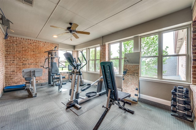 exercise room with ceiling fan, baseboards, visible vents, and a wealth of natural light
