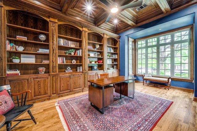 office featuring baseboards, light wood-style floors, coffered ceiling, beamed ceiling, and ornamental molding