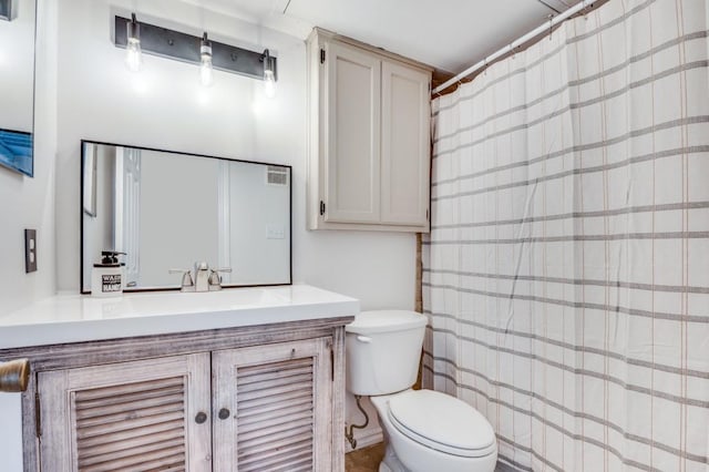 full bath with toilet and vanity