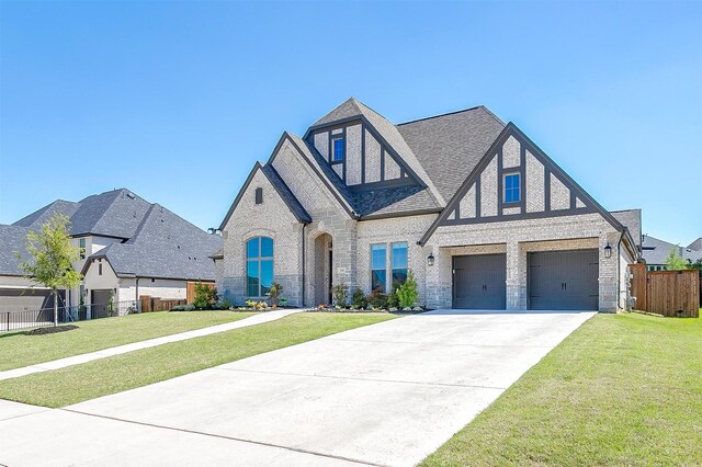 510 Syracuse St, Haslet, TX 76052 - view of front of home featuring a garage, concrete driveway, a shingled roof, and brick siding