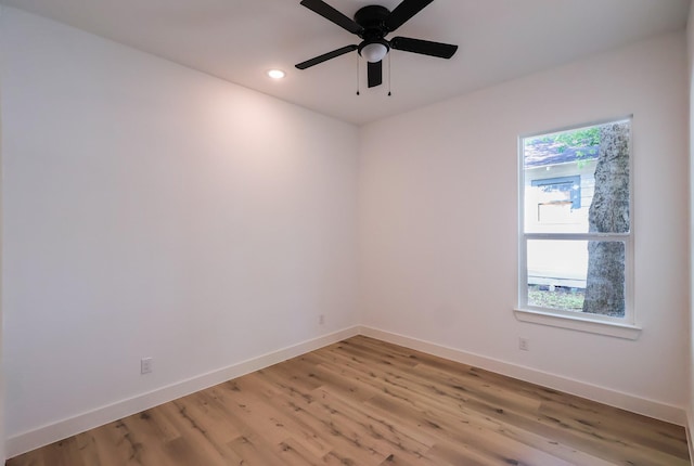 unfurnished room with ceiling fan, baseboards, light wood finished floors, and recessed lighting