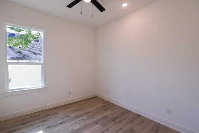empty room with light wood-style flooring, baseboards, recessed lighting, and a ceiling fan