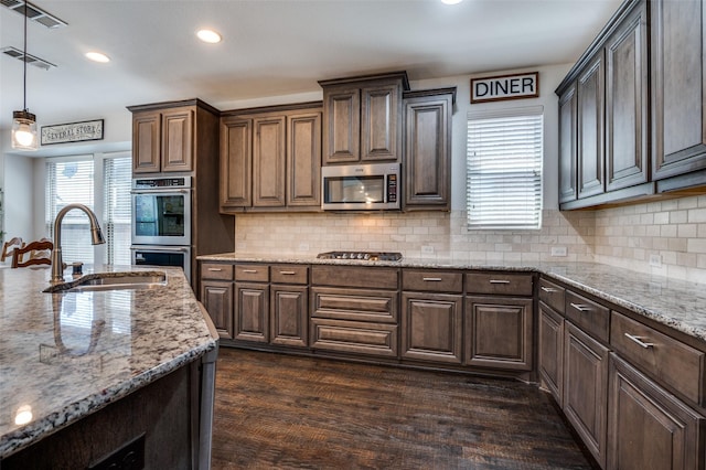 kitchen with recessed lighting, visible vents, stainless steel appliances, and a sink