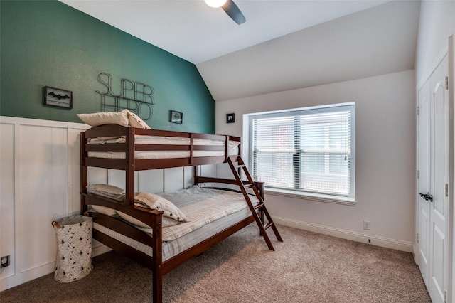 bedroom featuring light colored carpet, ceiling fan, vaulted ceiling, and baseboards