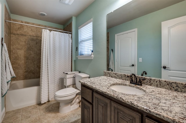 bathroom with tile patterned floors, shower / bath combo with shower curtain, vanity, and toilet