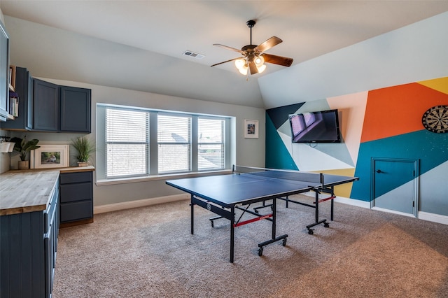 game room featuring light carpet, visible vents, baseboards, lofted ceiling, and a ceiling fan