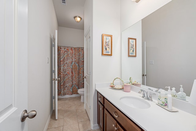 bathroom with tile patterned flooring, visible vents, toilet, vanity, and baseboards