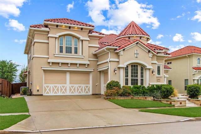 13043 Seattle Slew St, Frisco, TX 75035 - mediterranean / spanish house with an attached garage, driveway, a tiled roof, and stucco siding