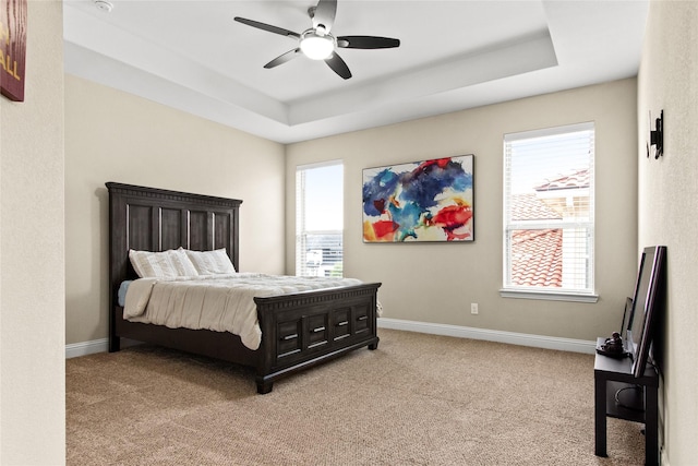 13043 Seattle Slew St, Frisco, TX 75035 - bedroom featuring a raised ceiling, light carpet, and multiple windows