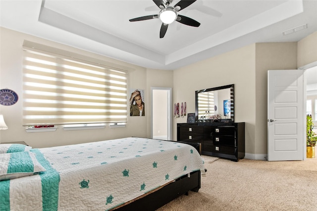 13043 Seattle Slew St, Frisco, TX 75035 - bedroom with a raised ceiling, multiple windows, carpet, and baseboards