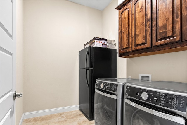 13043 Seattle Slew St, Frisco, TX 75035 - laundry area featuring washer and dryer, baseboards, and cabinet space